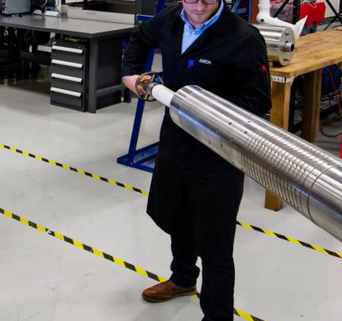 Photo of an engineer working on tools in the shop.